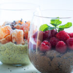 5-minute chocolate chia seed pudding in a glass jar topped with berries and cacao nibs
