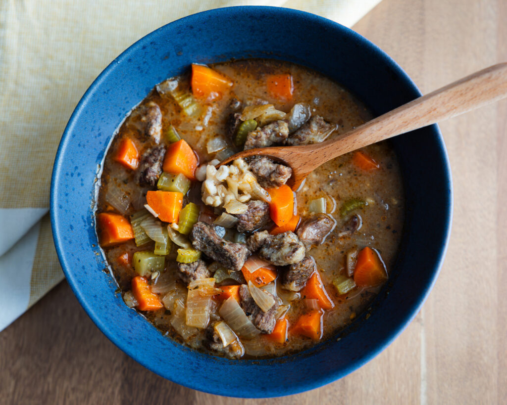 Hearty beef and barley soup with tender beef, carrots, celery, and pearl barley in a rich broth
