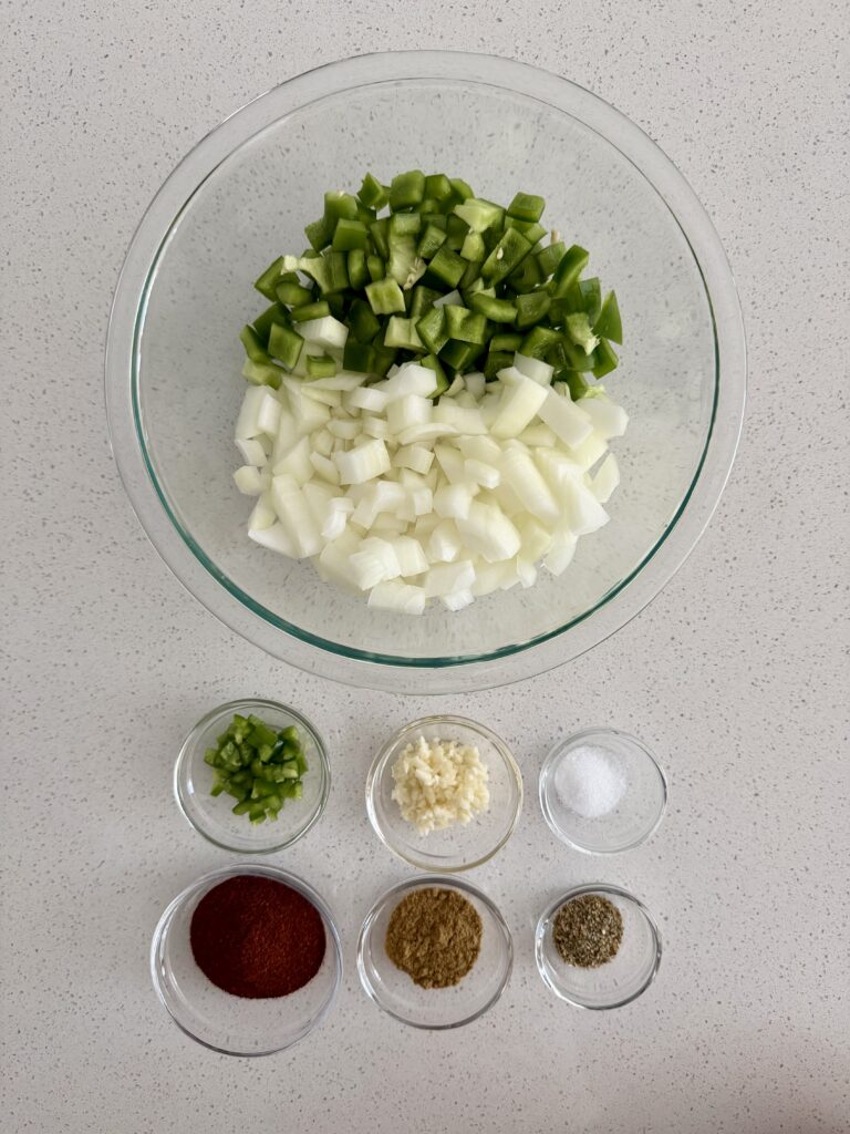 Diced onion, green bell pepper, jalapeño, minced garlic, and measured chili spices