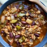 High-protein chicken chili with kidney beans in a bowl