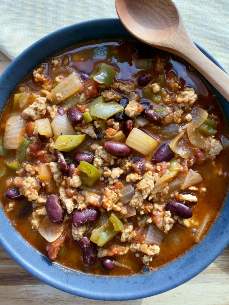 High-protein chicken chili with kidney beans in a bowl
