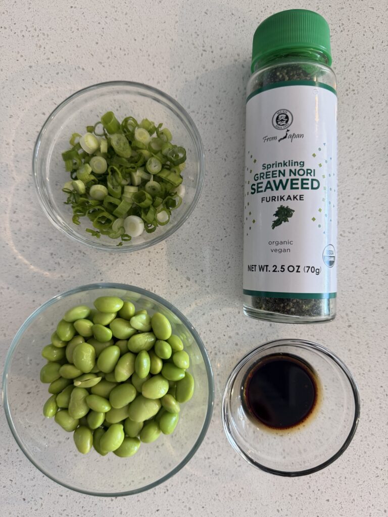 Cooked edamame, soy sauce and sesame oil mixture, chopped scallions, and furikake for a savory oatmeal bowl