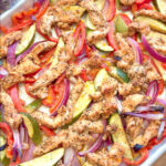 Mediterranean sheet pan chicken with roasted bell peppers, zucchini, and red onion